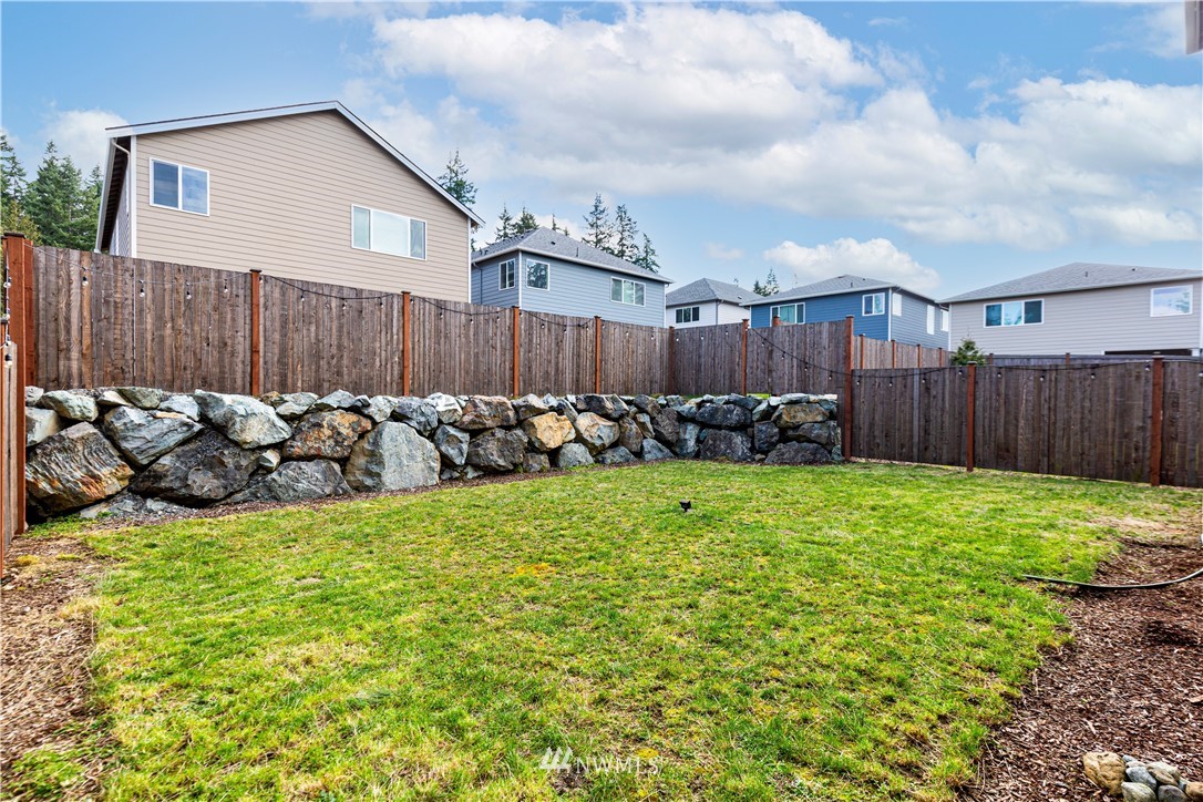 21325 43rd Drive Southeast Bothell, WA 98021 - Photo 31 of 32 a view of a backyard with wooden fence