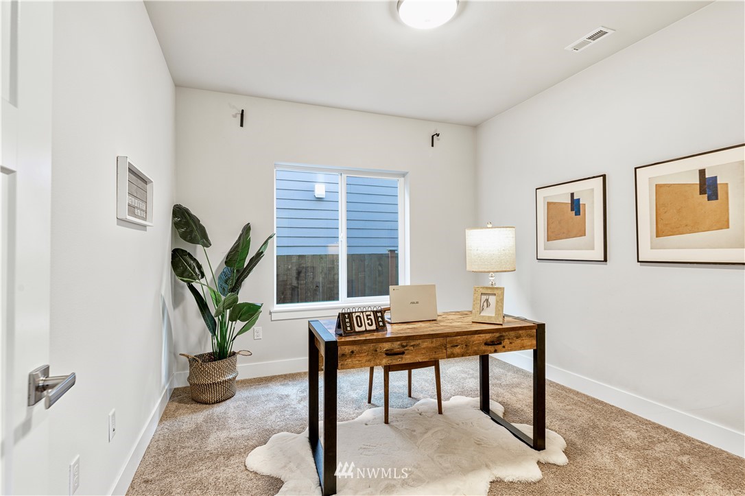 21325 43rd Drive Southeast Bothell, WA 98021 - Photo 5 of 32 a workspace with furniture and a potted plant