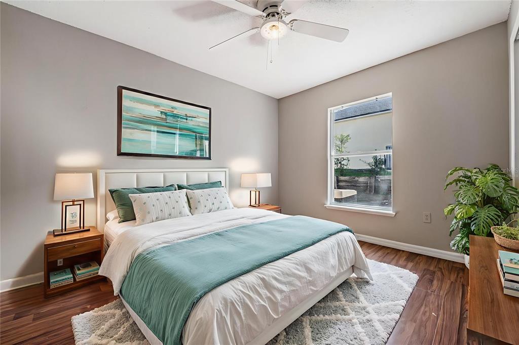 13364 Linden Drive Spring Hill, FL 34609 - Photo 18 of 28 a bedroom with a bed and a potted plant