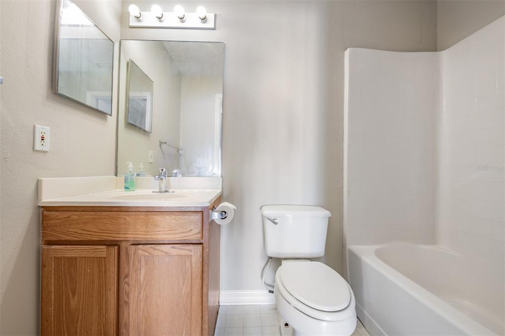 13364 Linden Drive Spring Hill, FL 34609 - Photo 20 of 28 a bathroom with a sink a toilet and shower