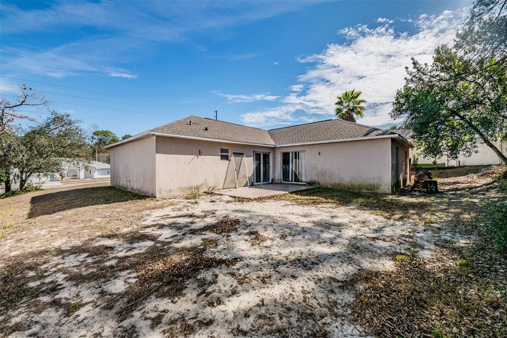 13364 Linden Drive Spring Hill, FL 34609 - Photo 24 of 28 a view of a house with a yard