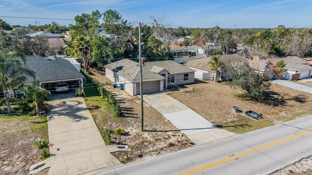 13364 Linden Drive Spring Hill, FL 34609 - Photo 27 of 28 an aerial view of a house with garden space and street view