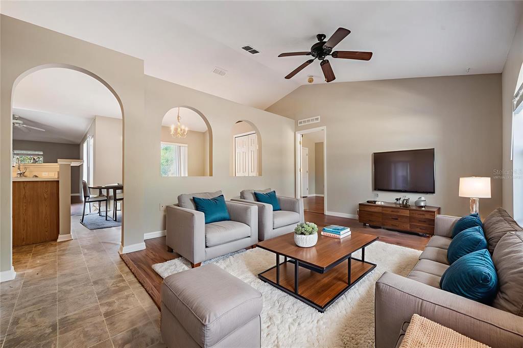 13364 Linden Drive Spring Hill, FL 34609 - Photo 5 of 28 a living room with furniture and a flat screen tv
