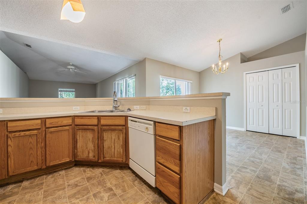 13364 Linden Drive Spring Hill, FL 34609 - Photo 7 of 28 a kitchen with a sink and cabinets