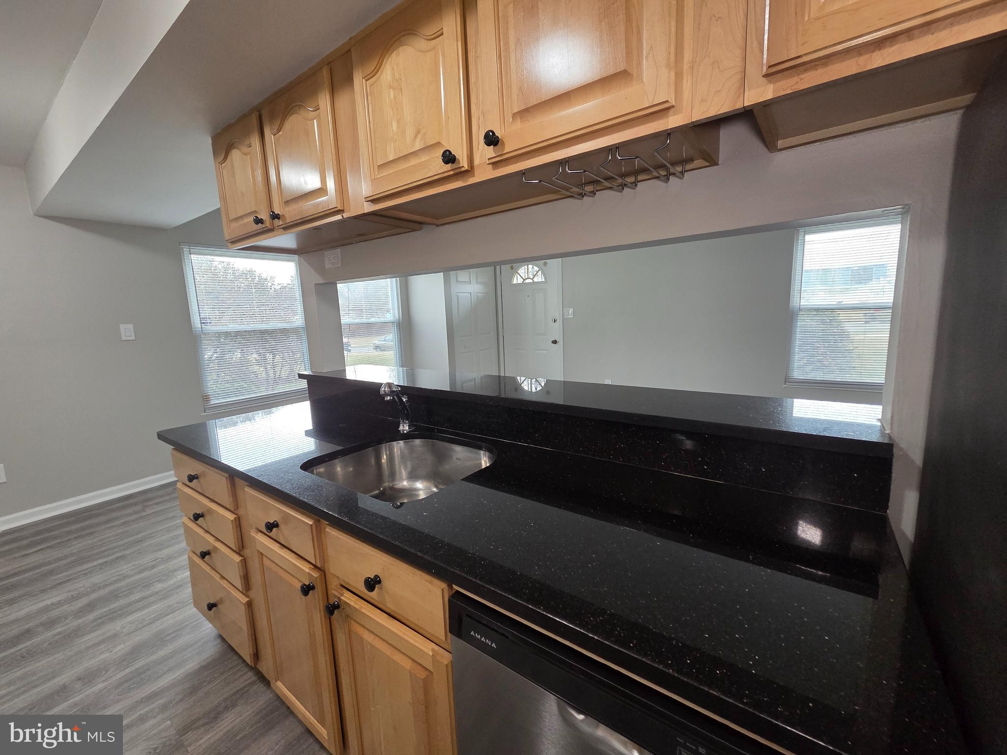 3291 Chester Grove Road Upper Marlboro, MD 20774 - Photo 12 of 38 a kitchen with stainless steel appliances a sink dishwasher a stove and a microwave oven