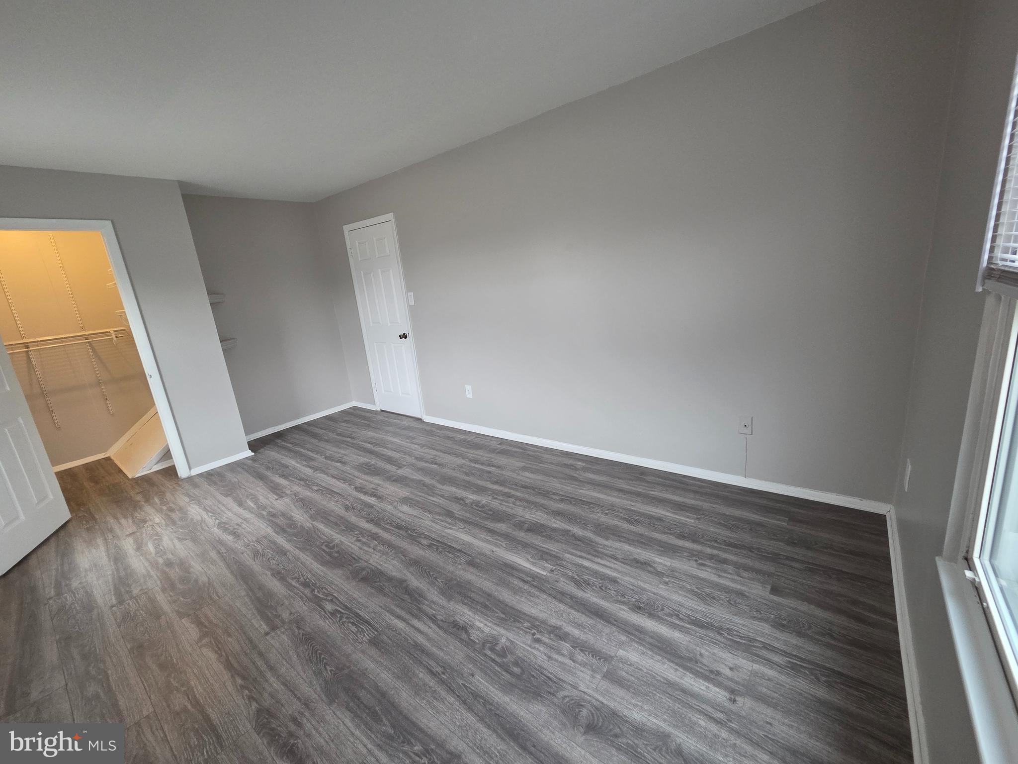 3291 Chester Grove Road Upper Marlboro, MD 20774 - Photo 23 of 38 wooden floor in an empty room with a window