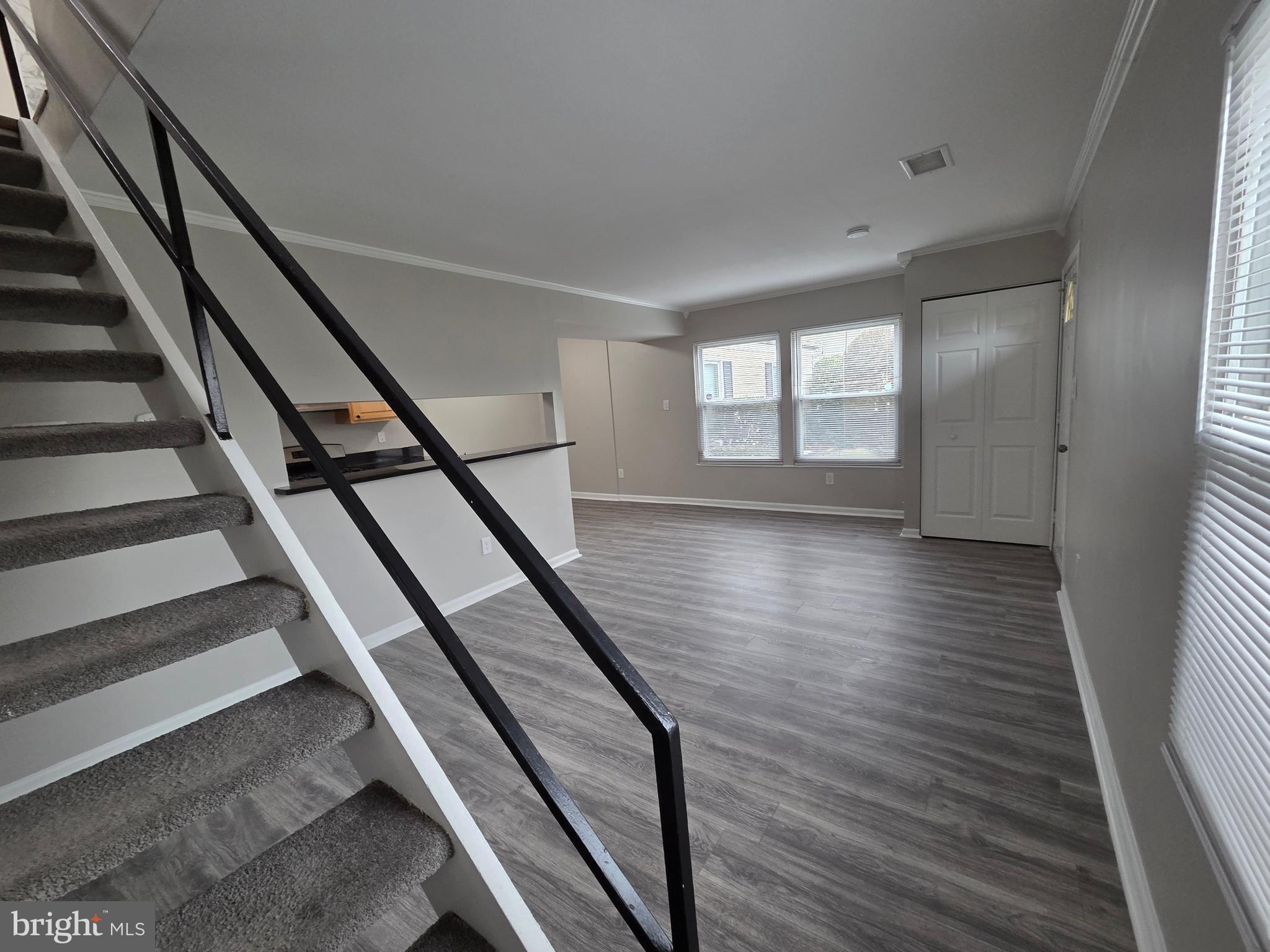 3291 Chester Grove Road Upper Marlboro, MD 20774 - Photo 5 of 38 wooden floor in an empty room with wooden floor and stairs