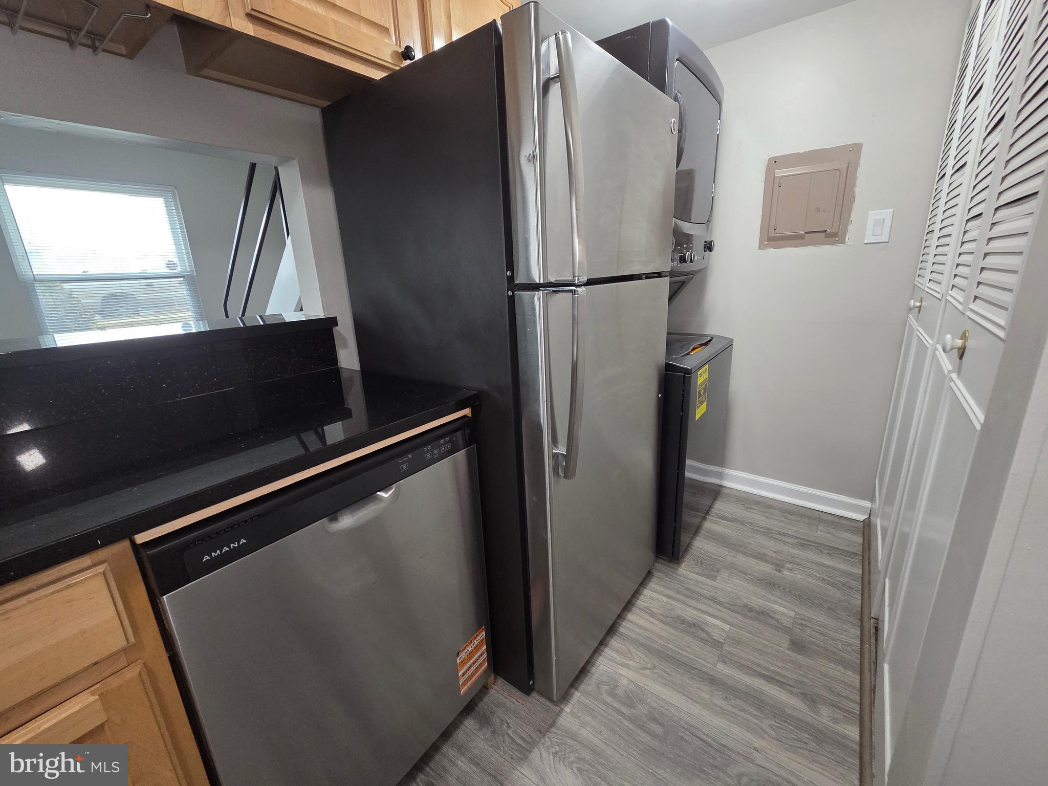 3291 Chester Grove Road Upper Marlboro, MD 20774 - Photo 10 of 38 a view of a refrigerator in kitchen and an empty room