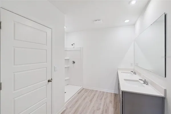 a bathroom with a sink and mirror