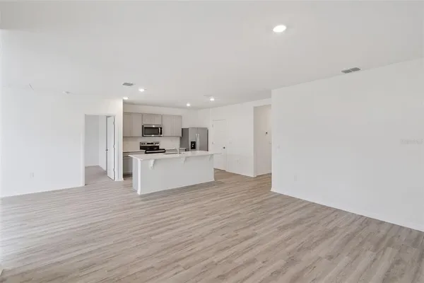 a view of kitchen with wooden floor