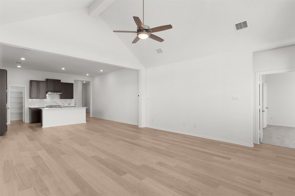 25621 Flora Bella Lane Elgin, TX 78621 - Photo 14 of 27 a view of a kitchen with a sink and a stove top oven