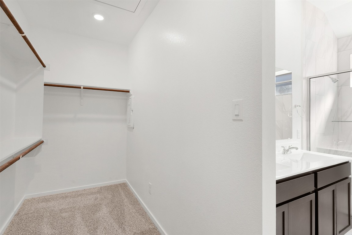 25621 Flora Bella Lane Elgin, TX 78621 - Photo 17 of 27 a bathroom with a sink and a mirror