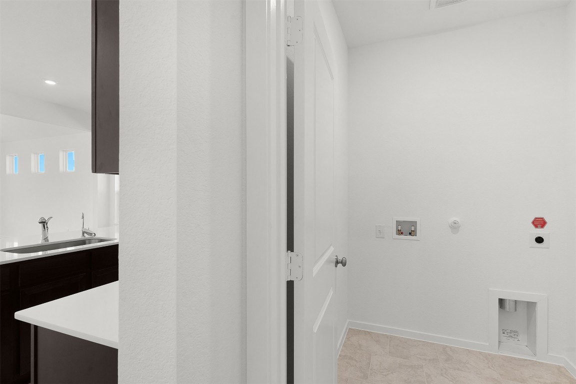 25621 Flora Bella Lane Elgin, TX 78621 - Photo 8 of 27 Washroom with hookup for a gas dryer, washer hookup, and electric dryer hookup