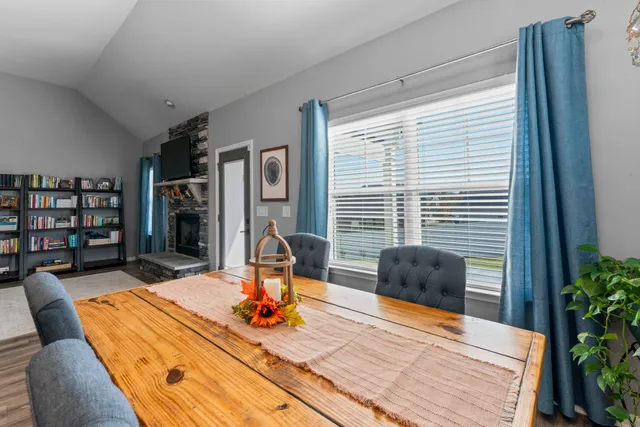 a bedroom with furniture and a wooden floor