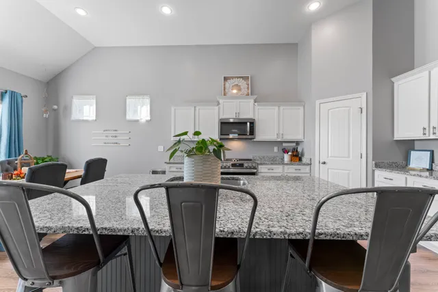 a spacious bedroom with a bed and a window