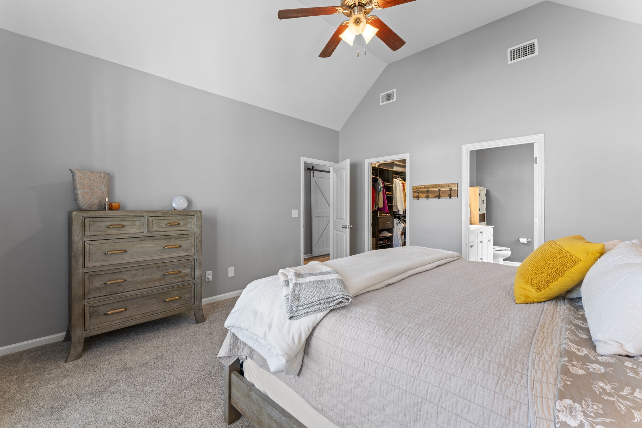 100 East Coker Way Spring Hill, TN 37174 - Photo 20 of 51 a bedroom with a bed and a chandelier