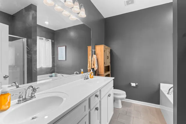 a en suite bathroom with a bathtub and a window