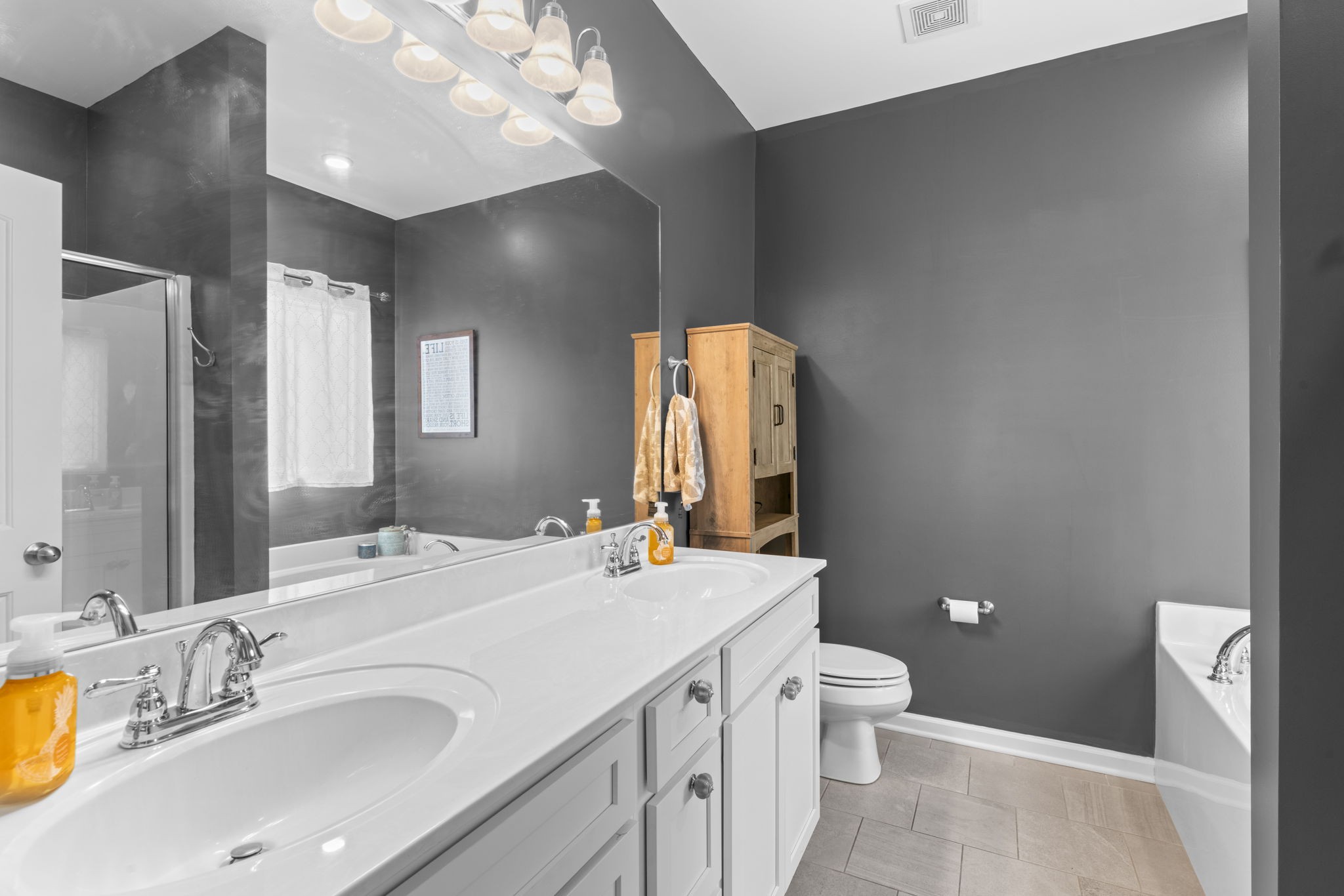 100 East Coker Way Spring Hill, TN 37174 - Photo 21 of 51 a bathroom with a sink double vanity granite and a toilet