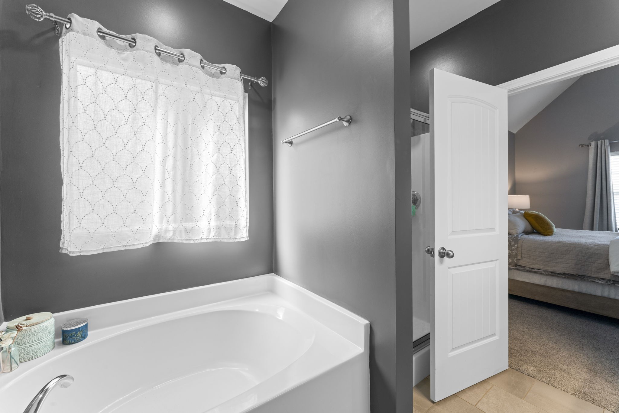 100 East Coker Way Spring Hill, TN 37174 - Photo 22 of 51 a en suite bathroom with a bathtub and a window