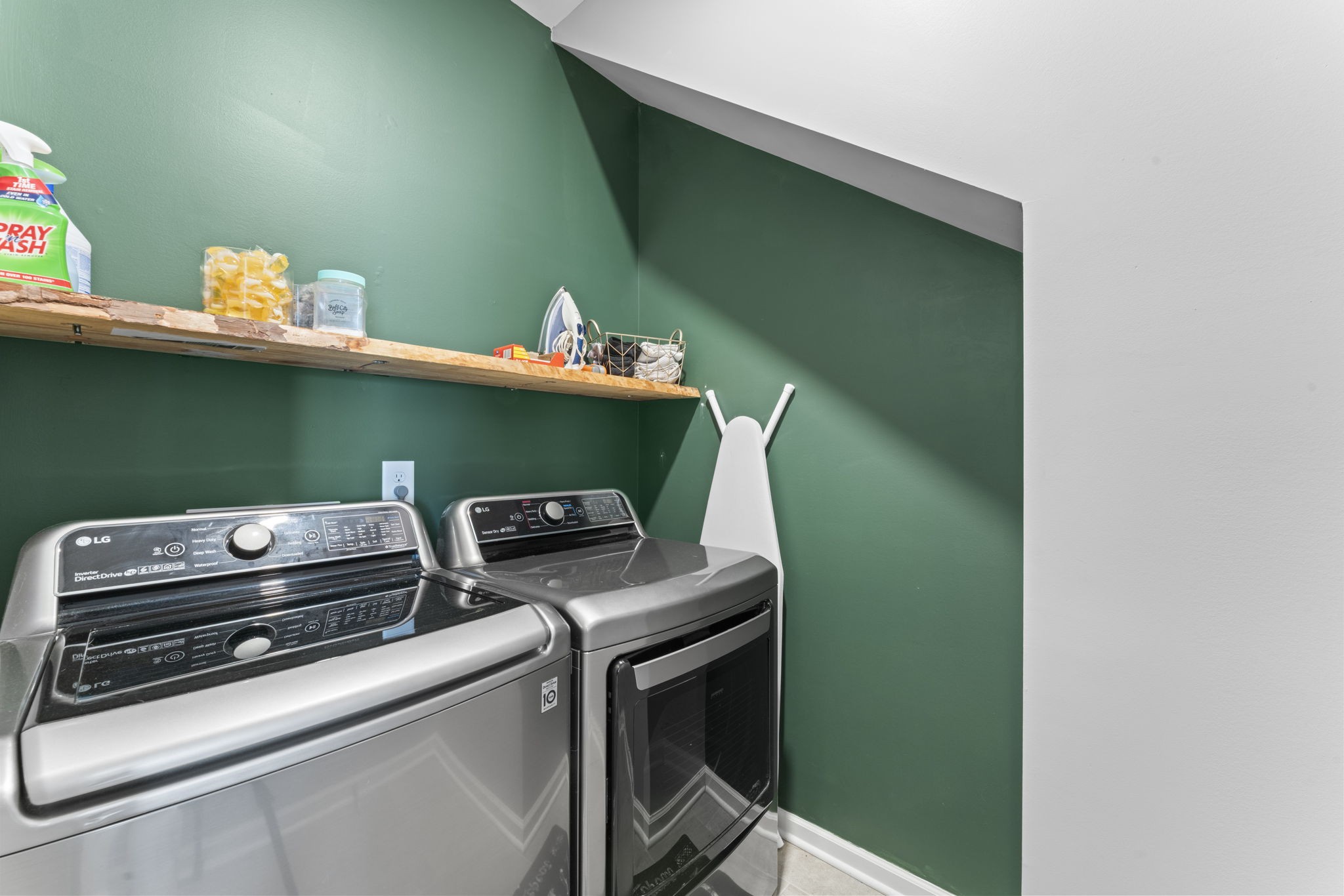 100 East Coker Way Spring Hill, TN 37174 - Photo 24 of 51 a room with washing machine and wooden floor