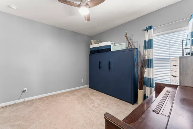 a living room with furniture and a piano