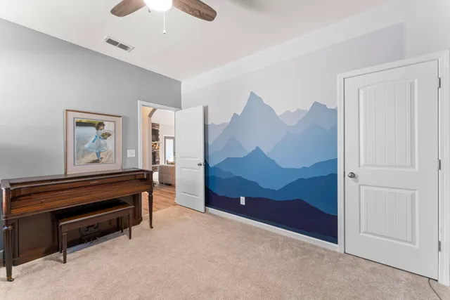 a bed room with a bed and a television