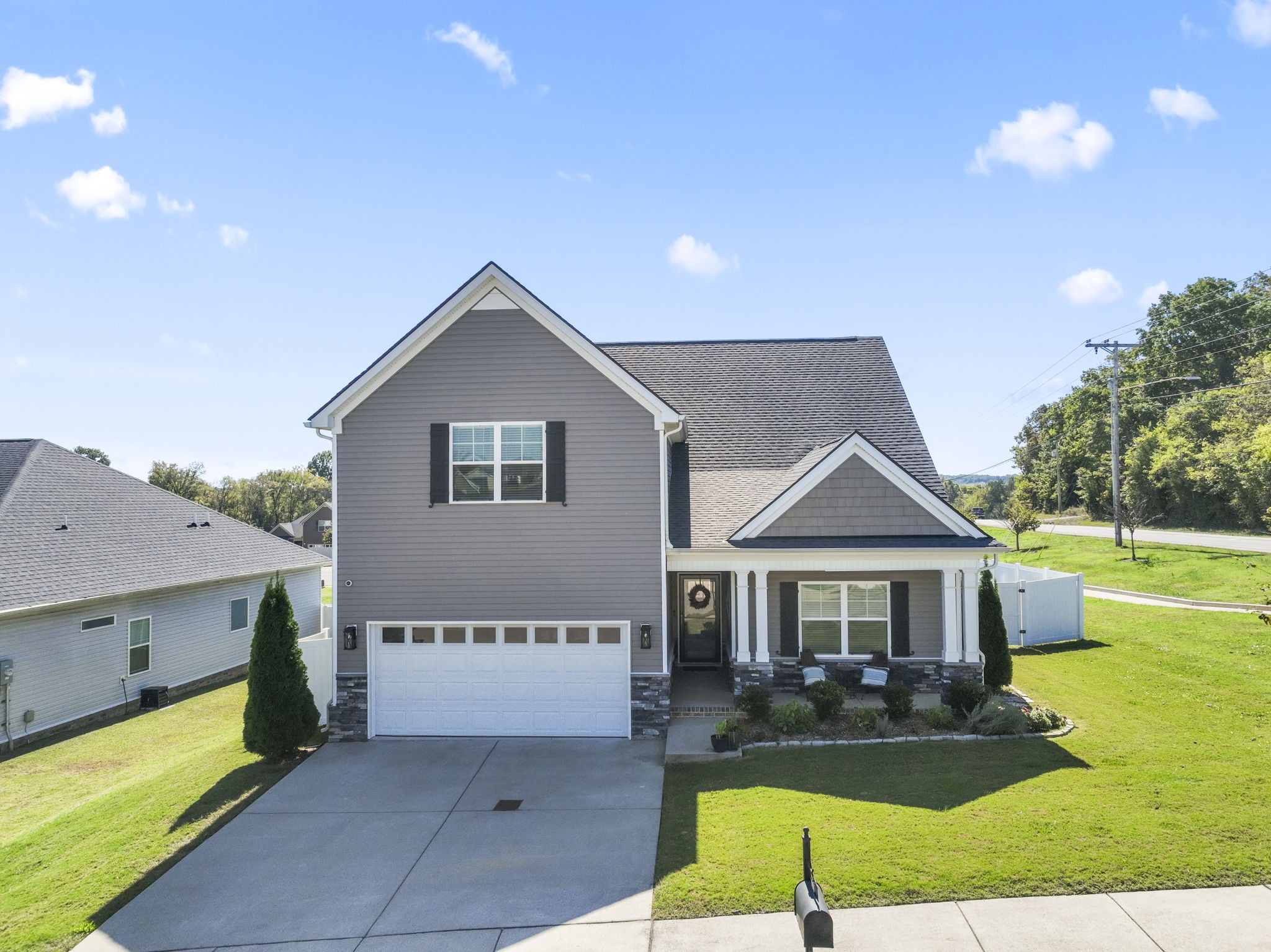 100 East Coker Way Spring Hill, TN 37174 - Photo 3 of 51 a front view of a house with garden