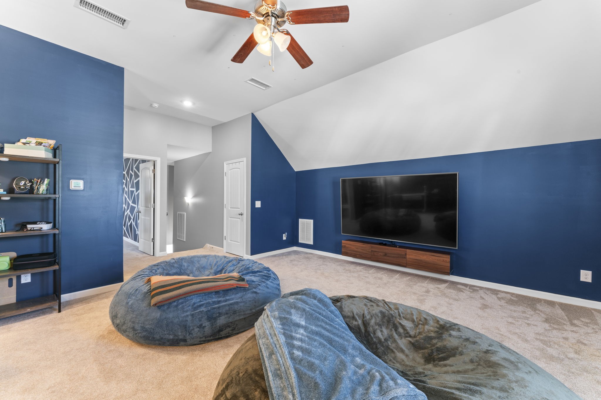 100 East Coker Way Spring Hill, TN 37174 - Photo 34 of 51 a bedroom with a bed and a flat screen tv