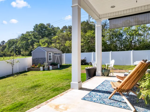 a view of yard with swimming pool and patio