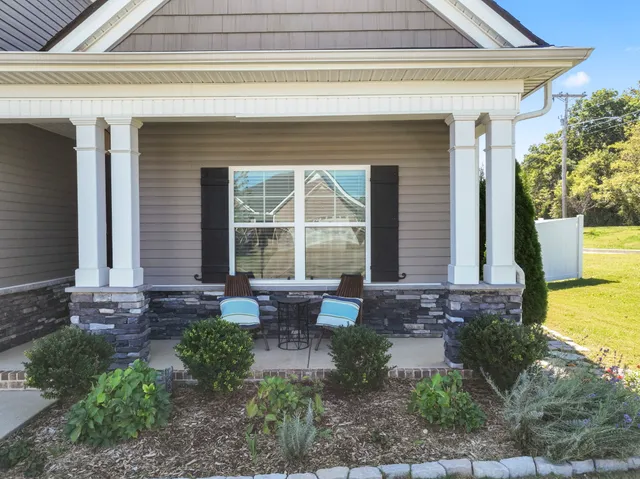 a front view of a house with garden