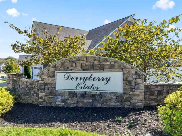 a view of a house with swimming pool and a yard