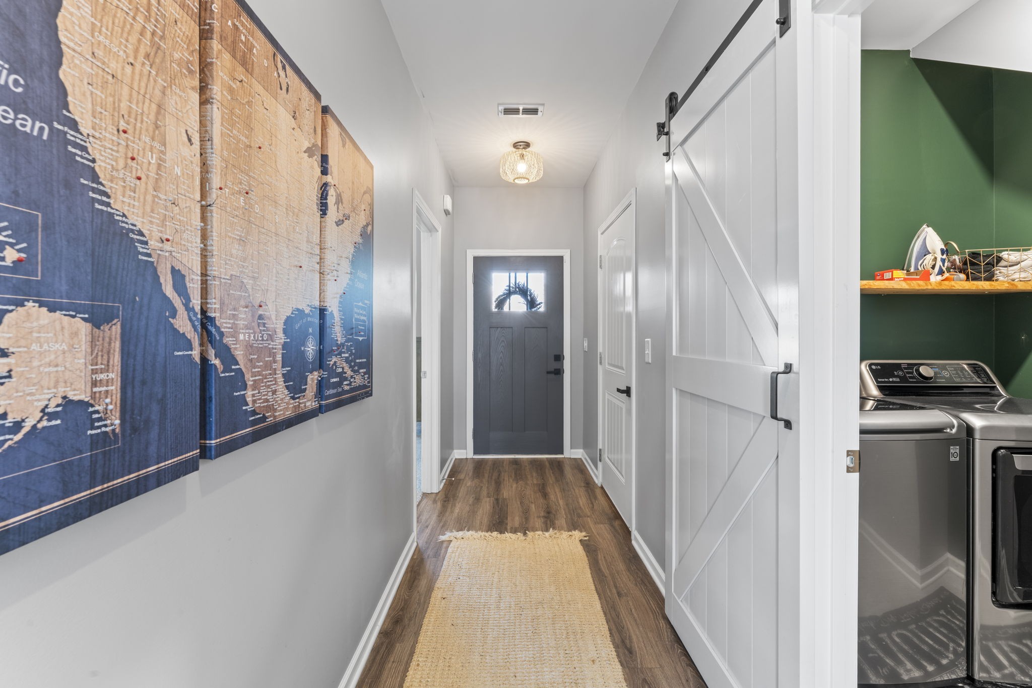 100 East Coker Way Spring Hill, TN 37174 - Photo 5 of 51 a view of a hallway with wooden floor and staircase