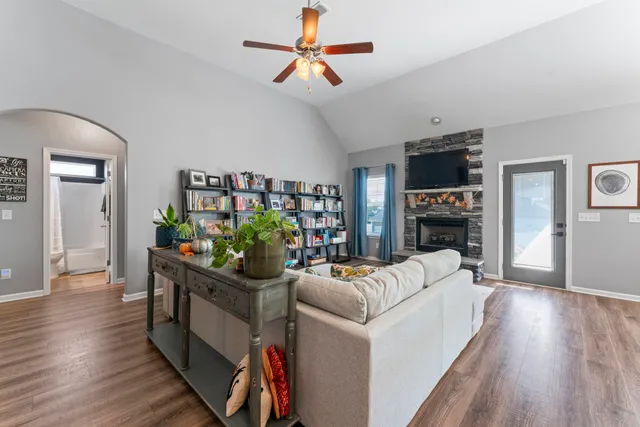 a living room with furniture and a fireplace