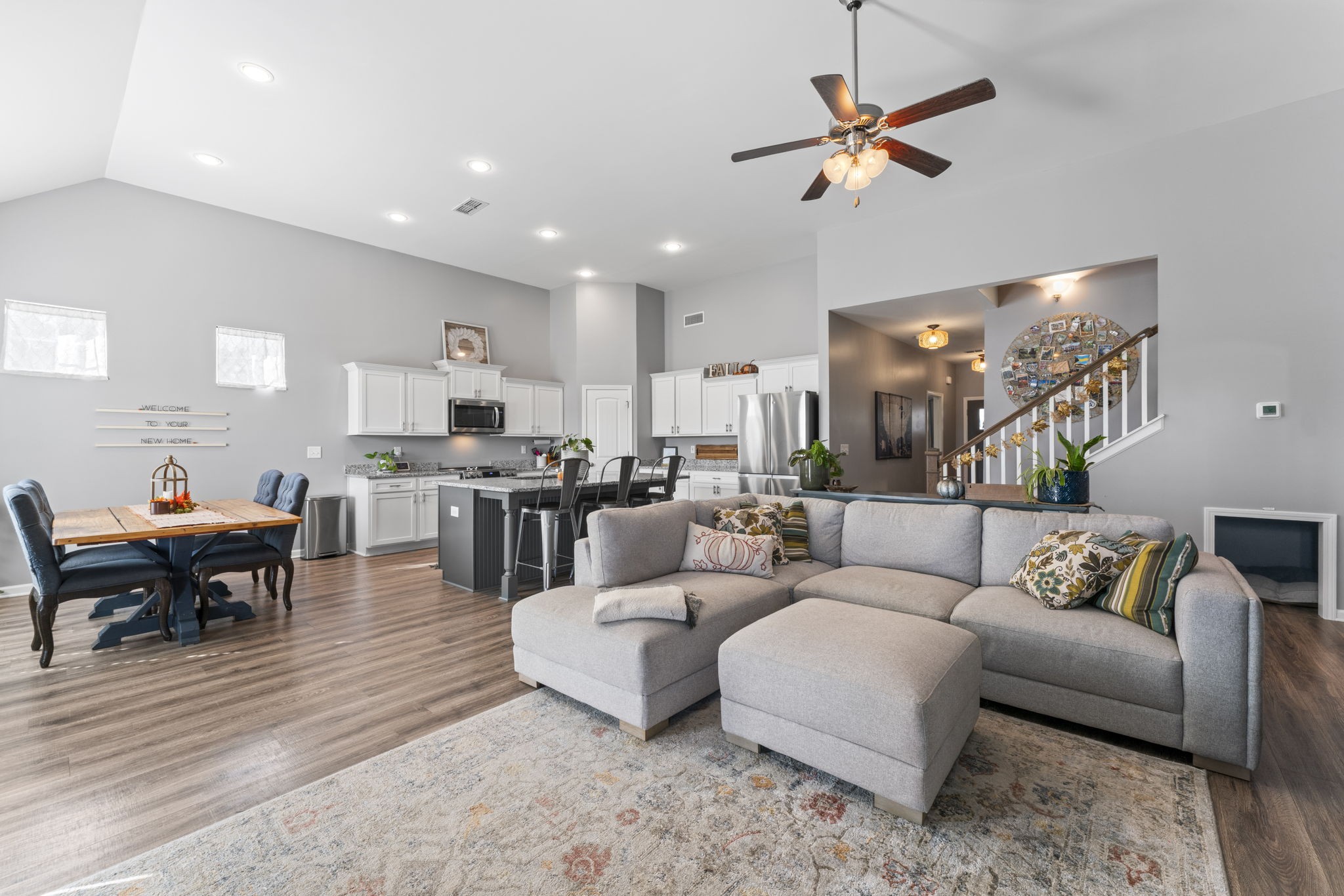 100 East Coker Way Spring Hill, TN 37174 - Photo 10 of 51 a living room with furniture kitchen view and a dining table