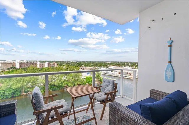 a view of a balcony with furniture