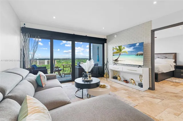 a living room with furniture and a large window