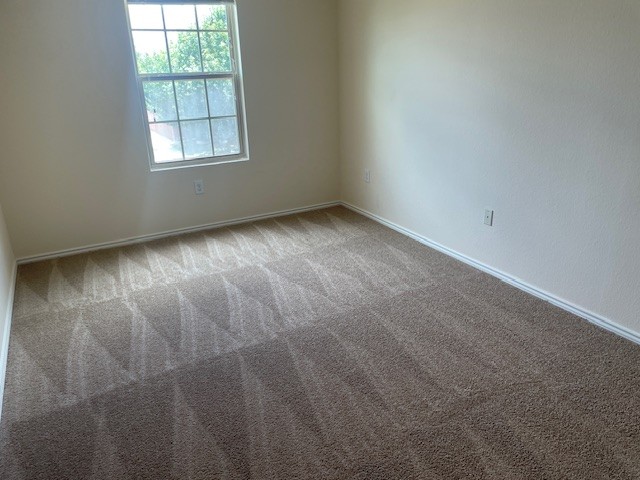 10201 Gertrudis Loop Austin, TX 78747 - Photo 21 of 24 A well-lit bedroom with pristine carpeting awaits your personal touch.
