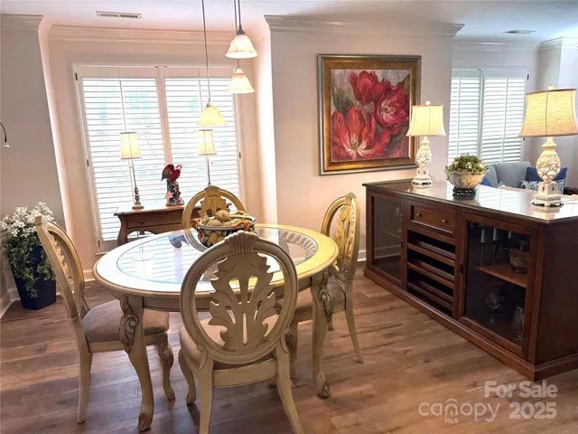 a view of a dining room with furniture and window