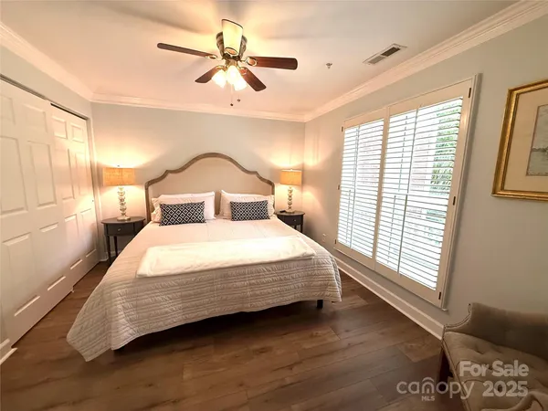 a bedroom with a large bed and a window