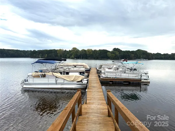 a view of a lake with a table and chairs
