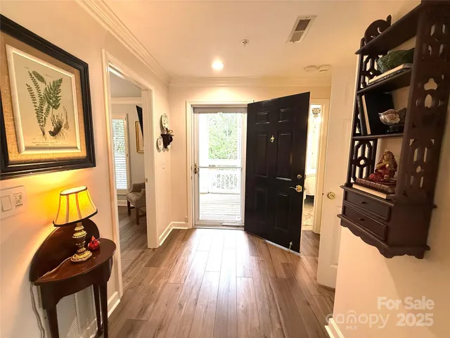 a view of a livingroom with furniture and wooden floor