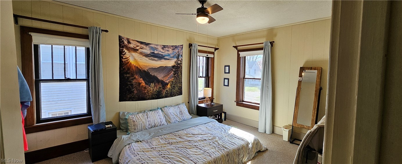 1050 Cambridge Road Coshocton, OH 43812 - Photo 29 of 50 Carpeted bedroom featuring a textured ceiling and ceiling fan
