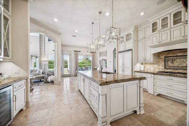 a dining room with kitchen island dining table and chairs