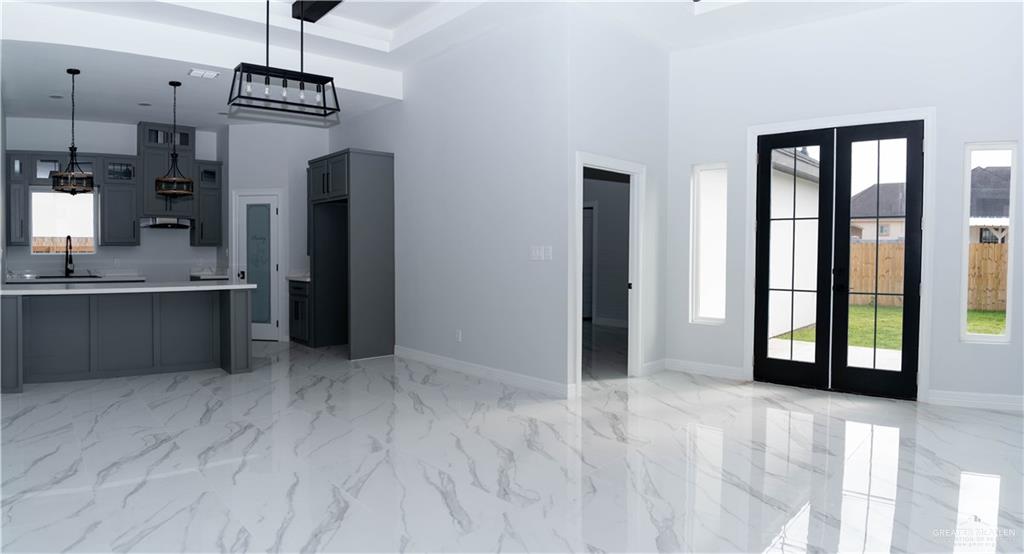 512 Spring Drive Alton, TX 78573 - Photo 3 of 18 a view of a kitchen with stainless steel appliances granite countertop a refrigerator and a sink