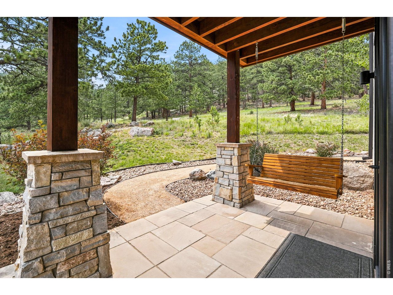 575 Reed Ranch Road Boulder, CO 80302 - Photo 22 of 47 a view of a porch with furniture and yard