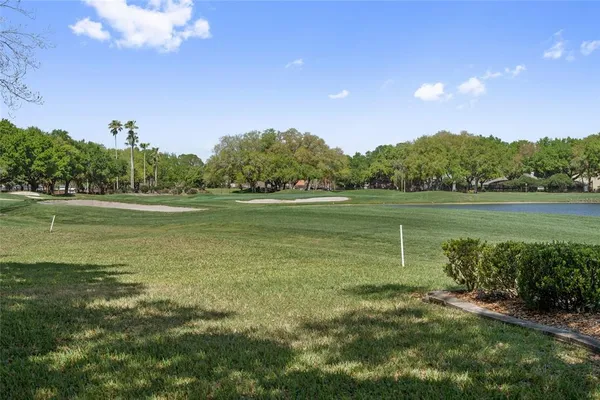 a view of a lake with a big yard