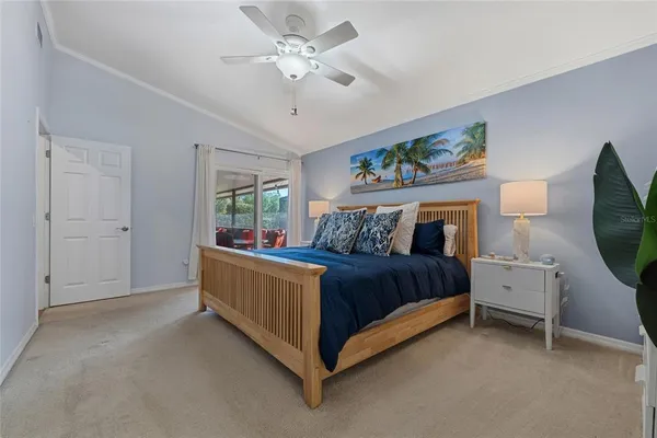 a bed room with a bed and a chandelier