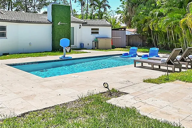 a view of a backyard with a sitting area