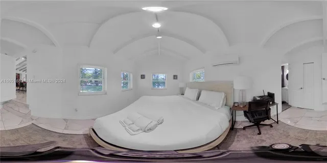 a living room with furniture and a lamp