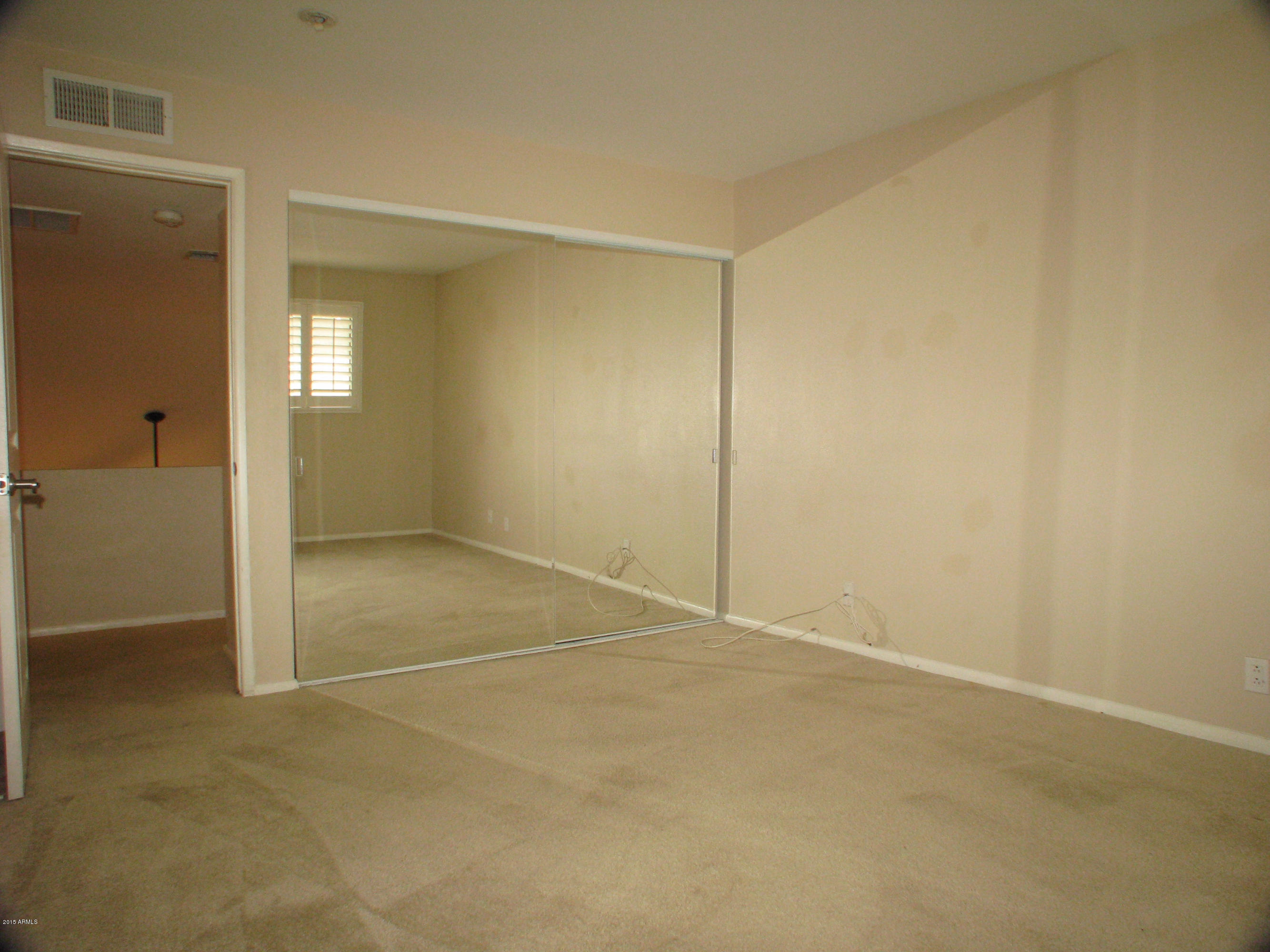 3807 North 30th Street, Unit 8 Phoenix, AZ 85016 - Photo 14 of 24 an empty room with an entryway